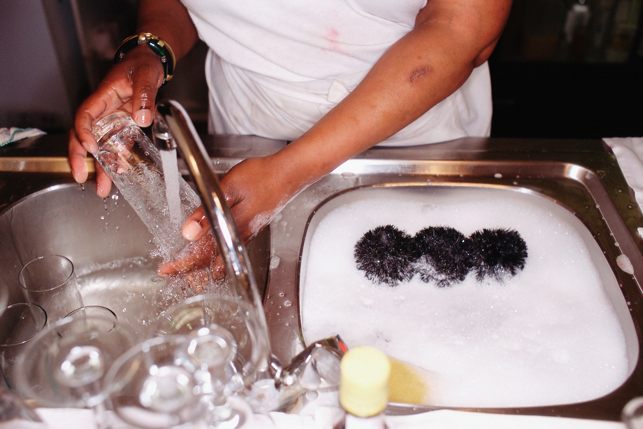 A person washing dishes