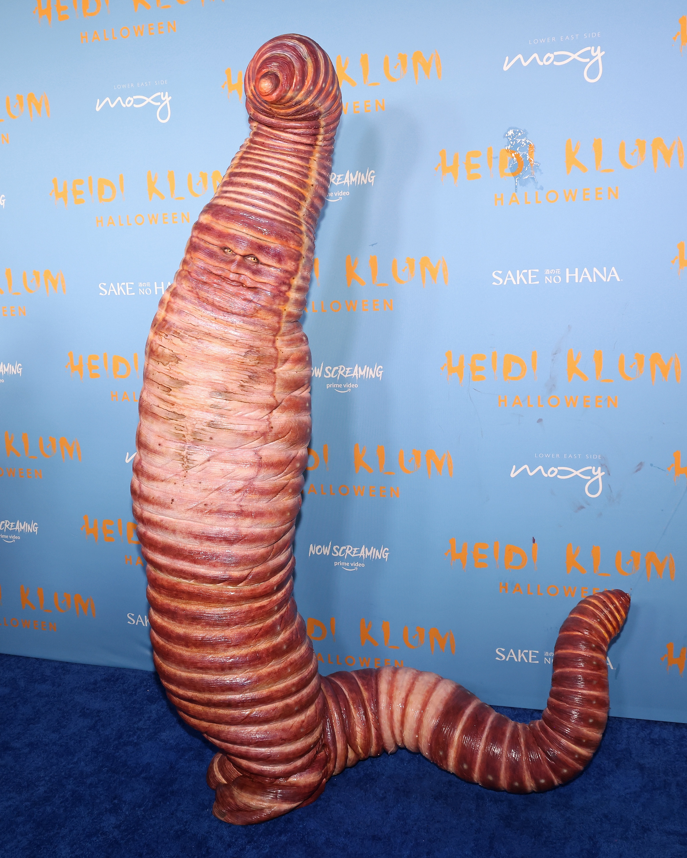 a giant worm costume at an event