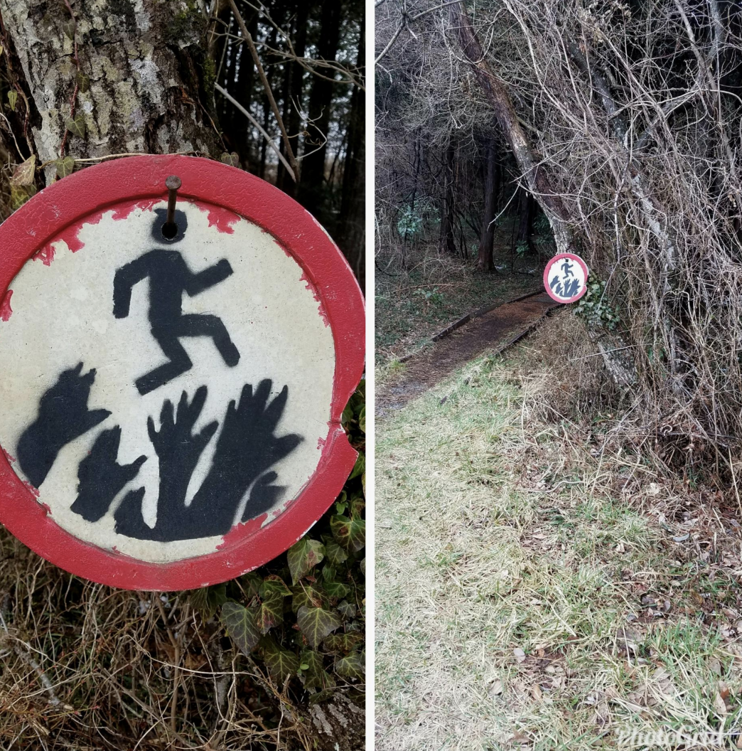 a warning sign in the woods