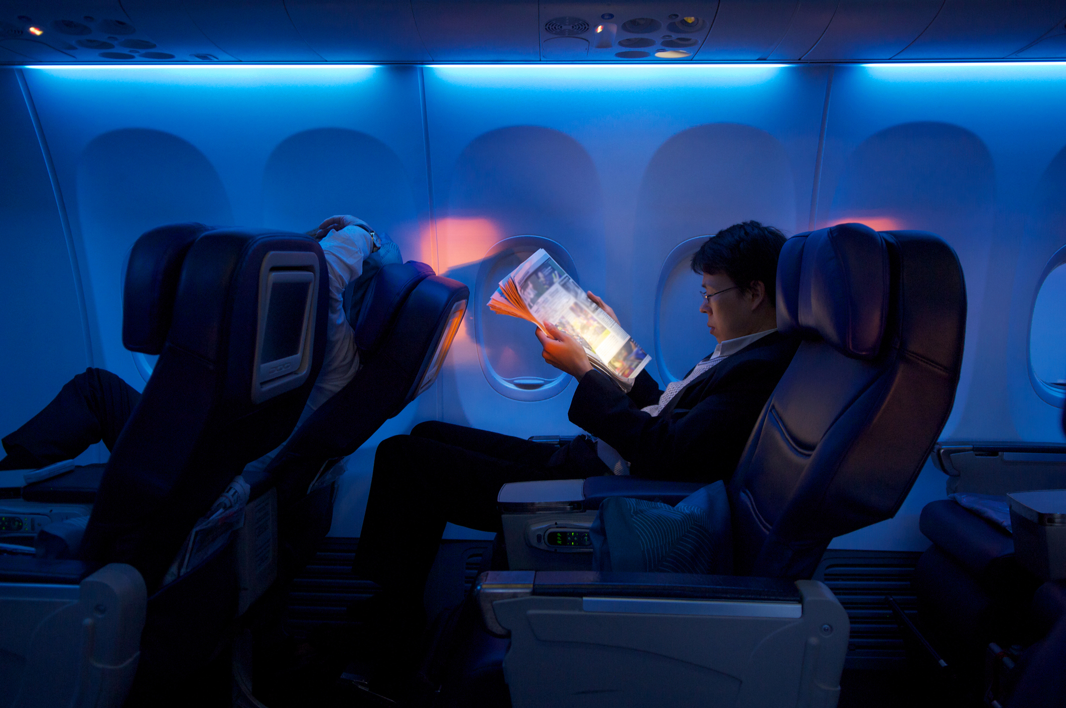 A man is enjoying his business class flight