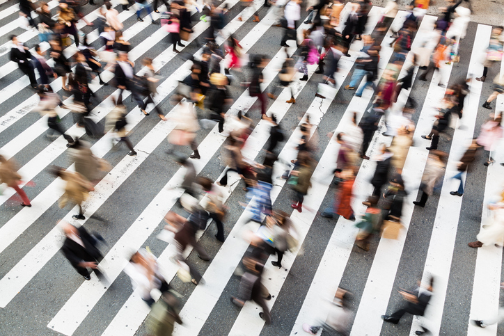 Blurry people walking down the street