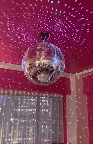A gif of a disco ball spinning