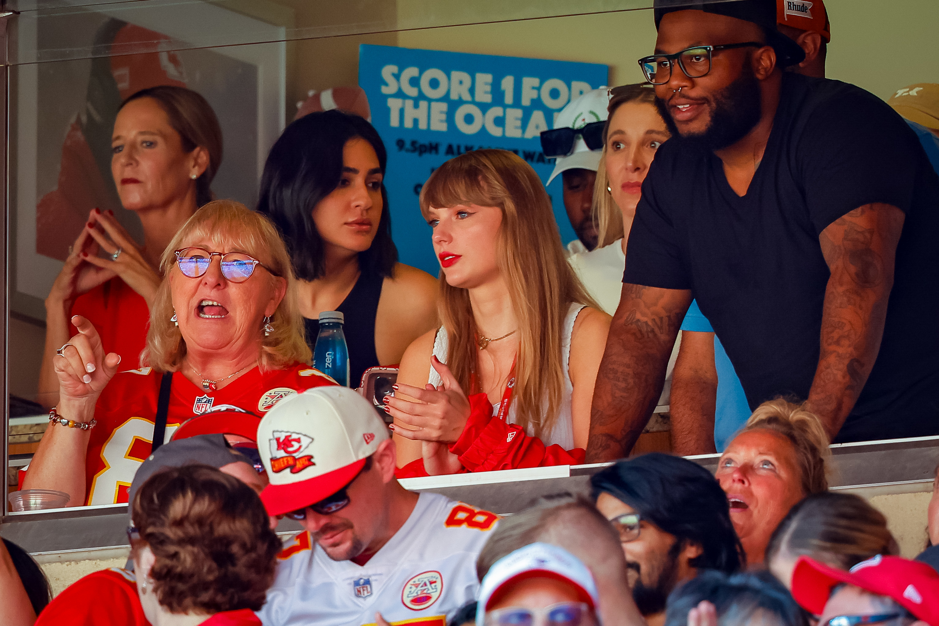 taylor, donna, and a crowd of people in the suite