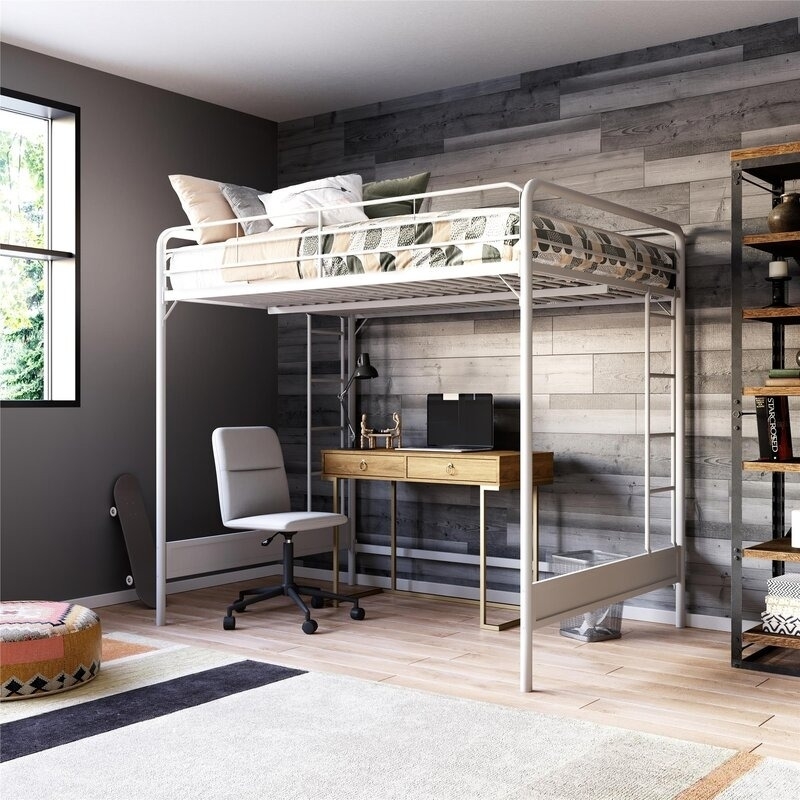 the loft bed in white with a desk underneath