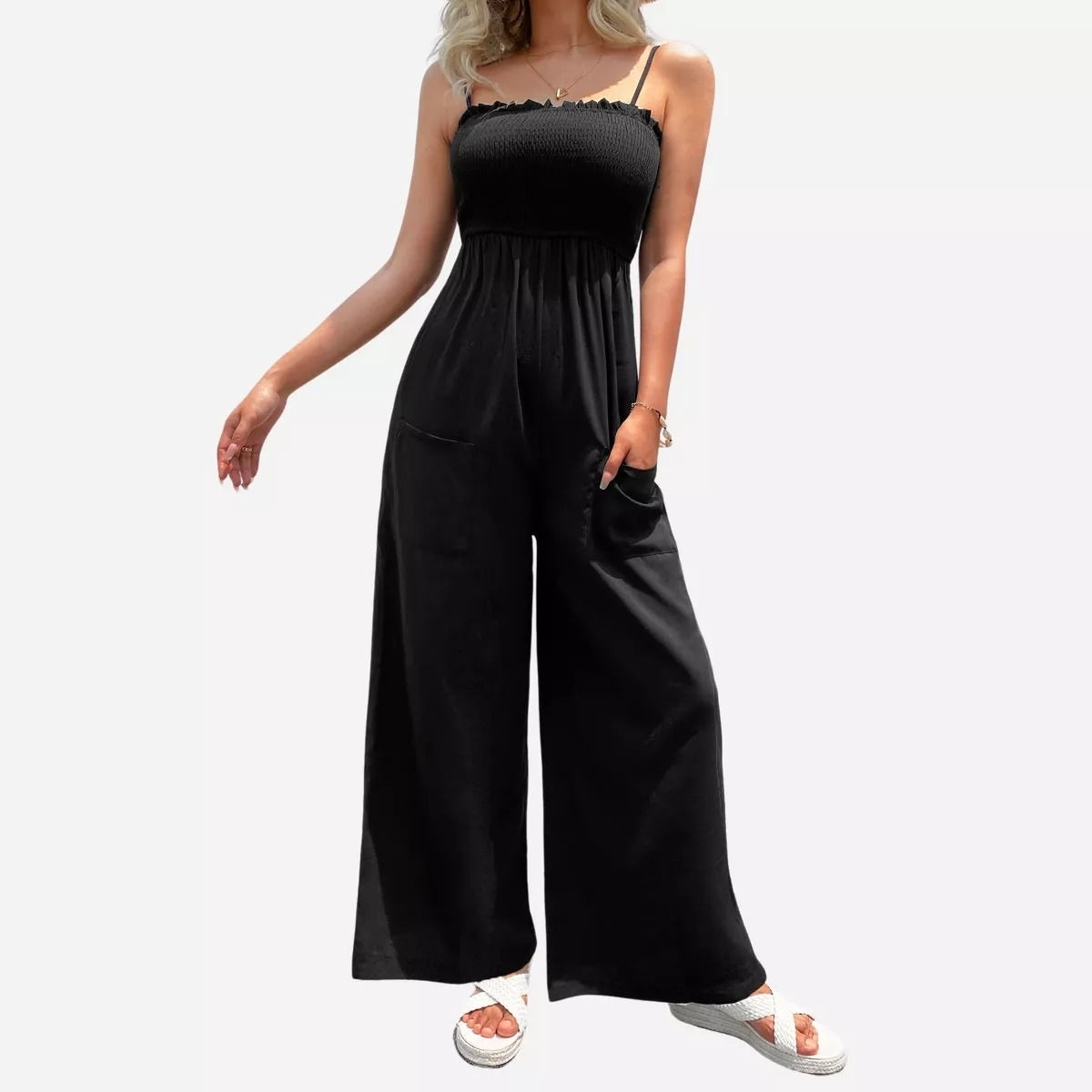 black jumpsuit and spaghetti straps on model