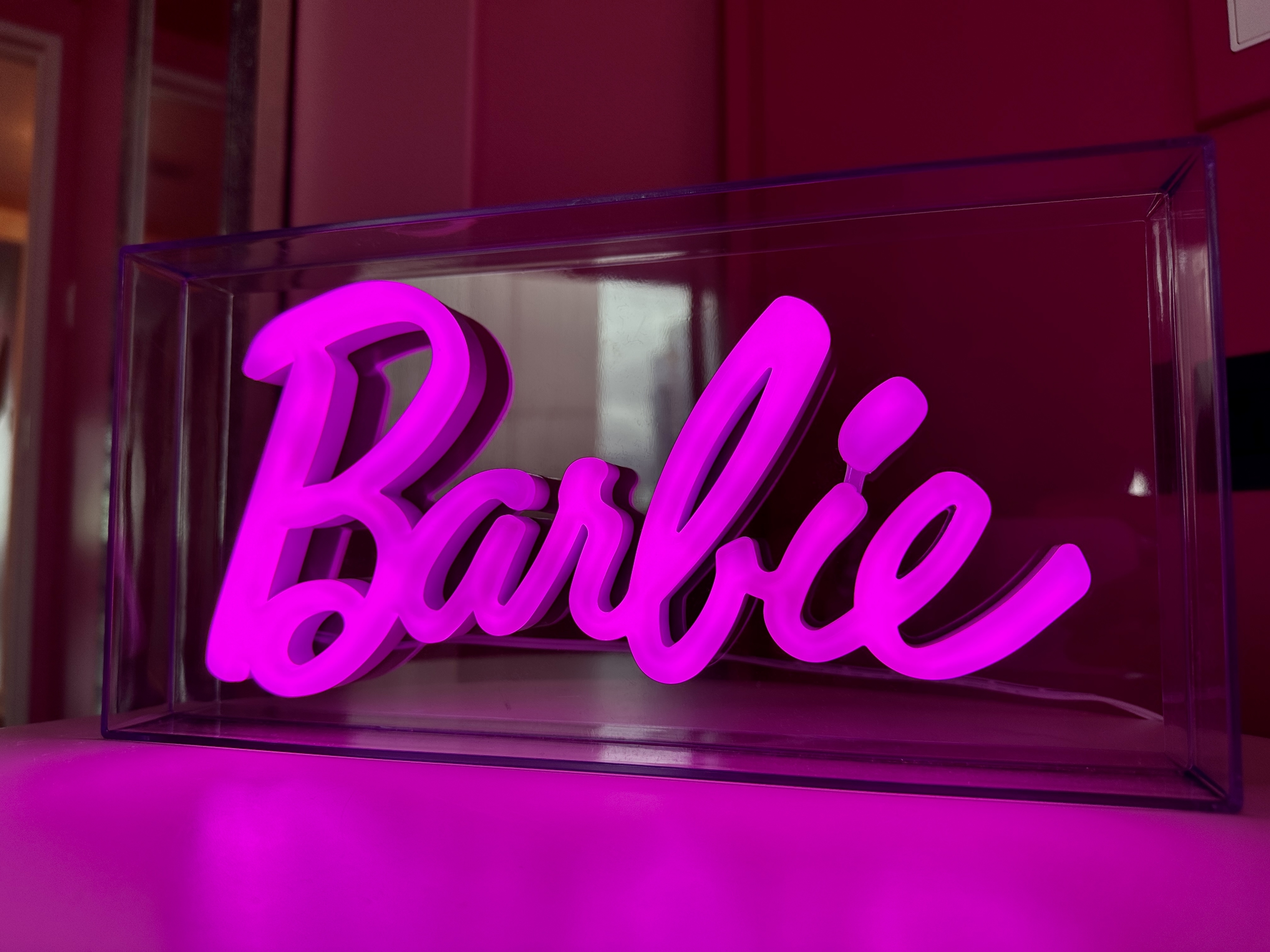A pink Barbie neon sign