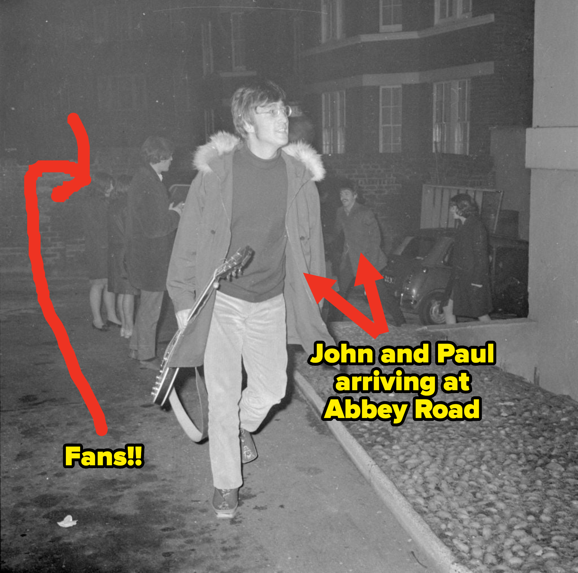 john and paul walking to the studio with fans behind them