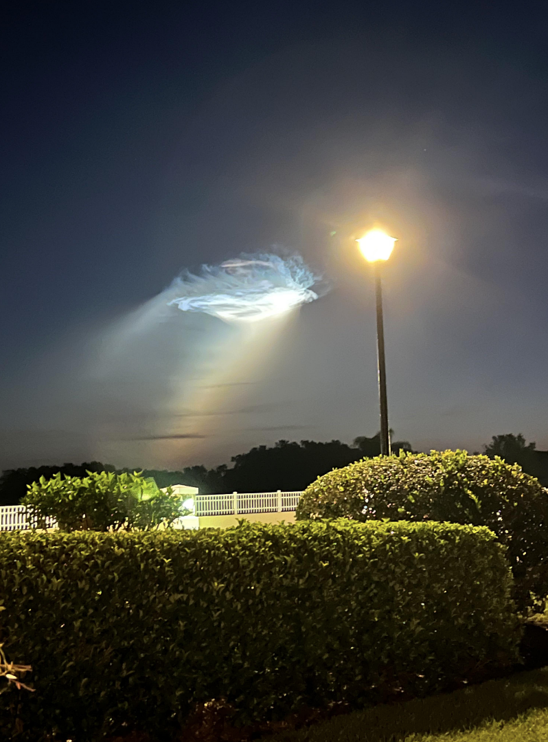 a strange orb emitting light in the sky