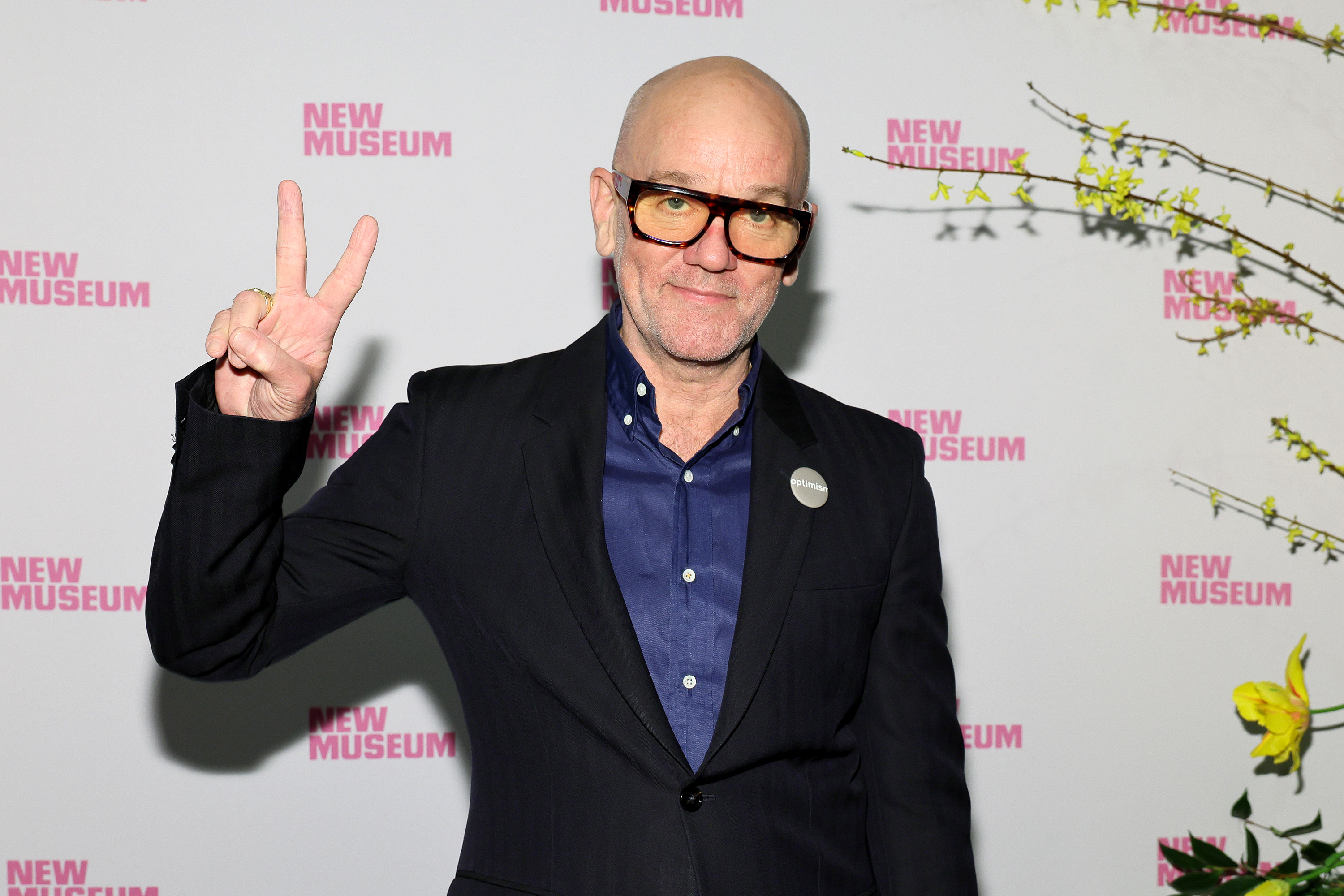 Michael Stipe giving the peace sign
