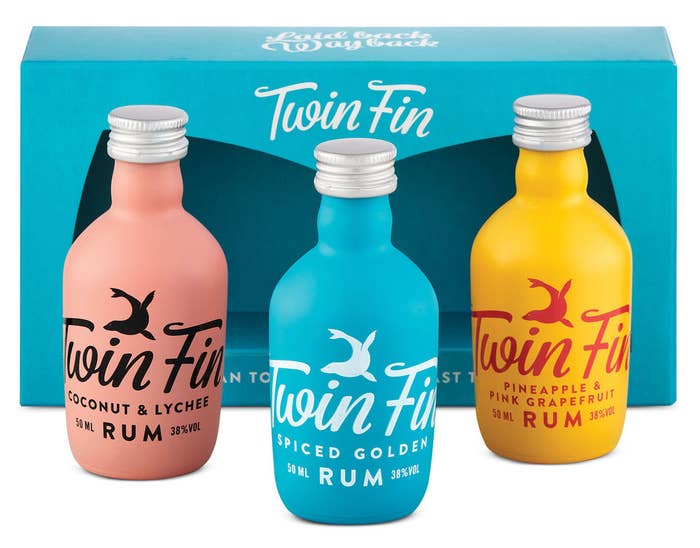 Three mini bottle of Twin Fin in front of their package