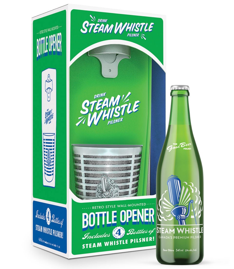 A bottle of Steam Whistle in front of a bottle opener in its package