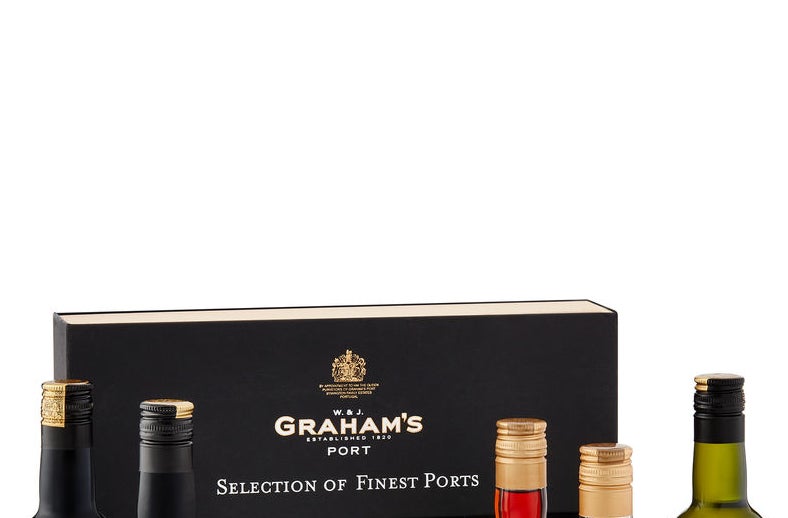 A selection of small bottles of port in front of their gift box