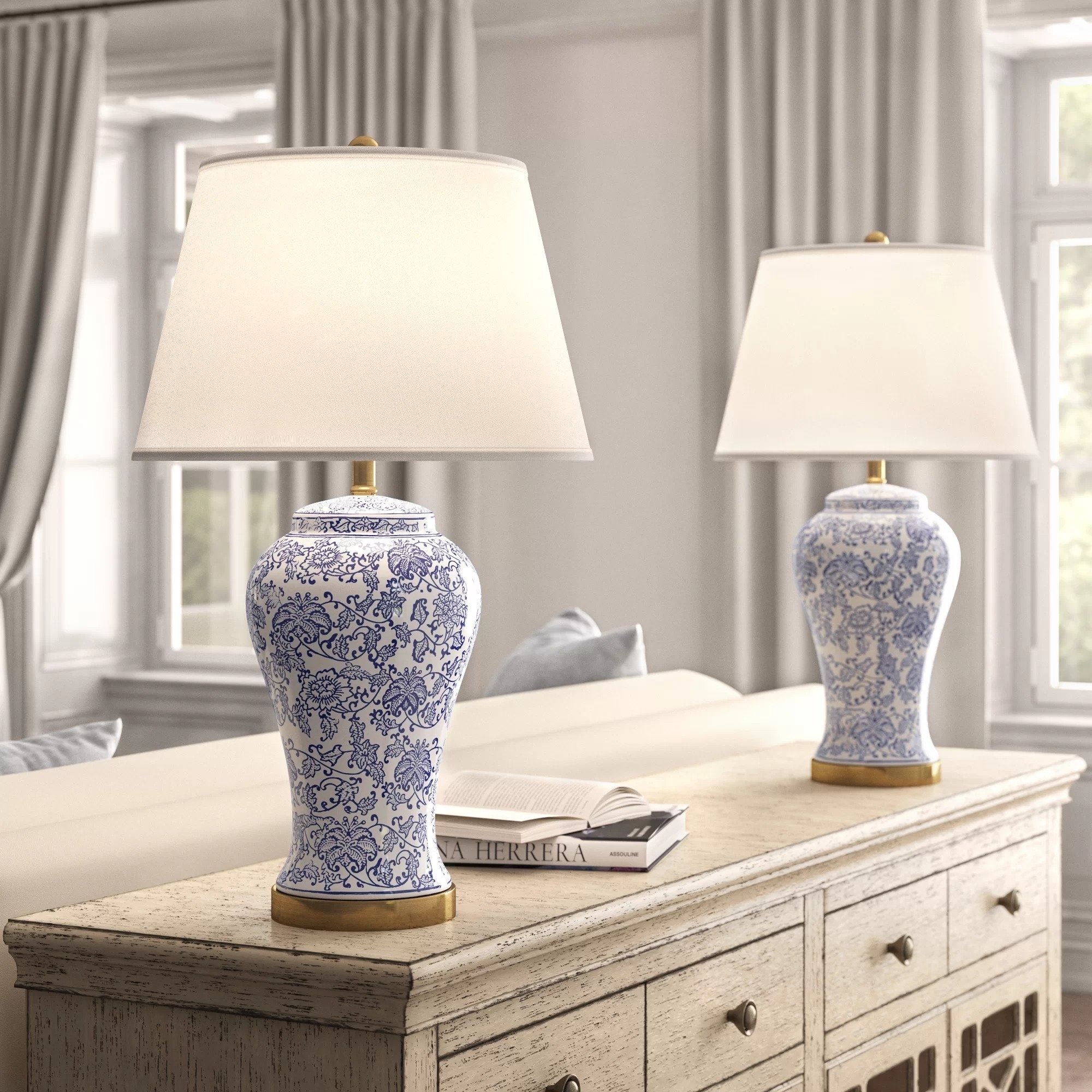 The lamps, with a base that features a blue and white floral design