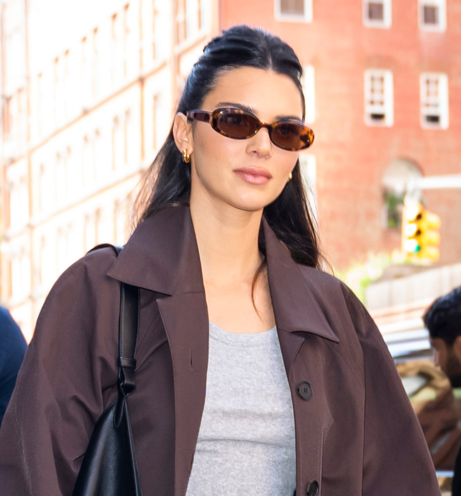 Closeup of Kendall Jenner walking outside in sunglasses