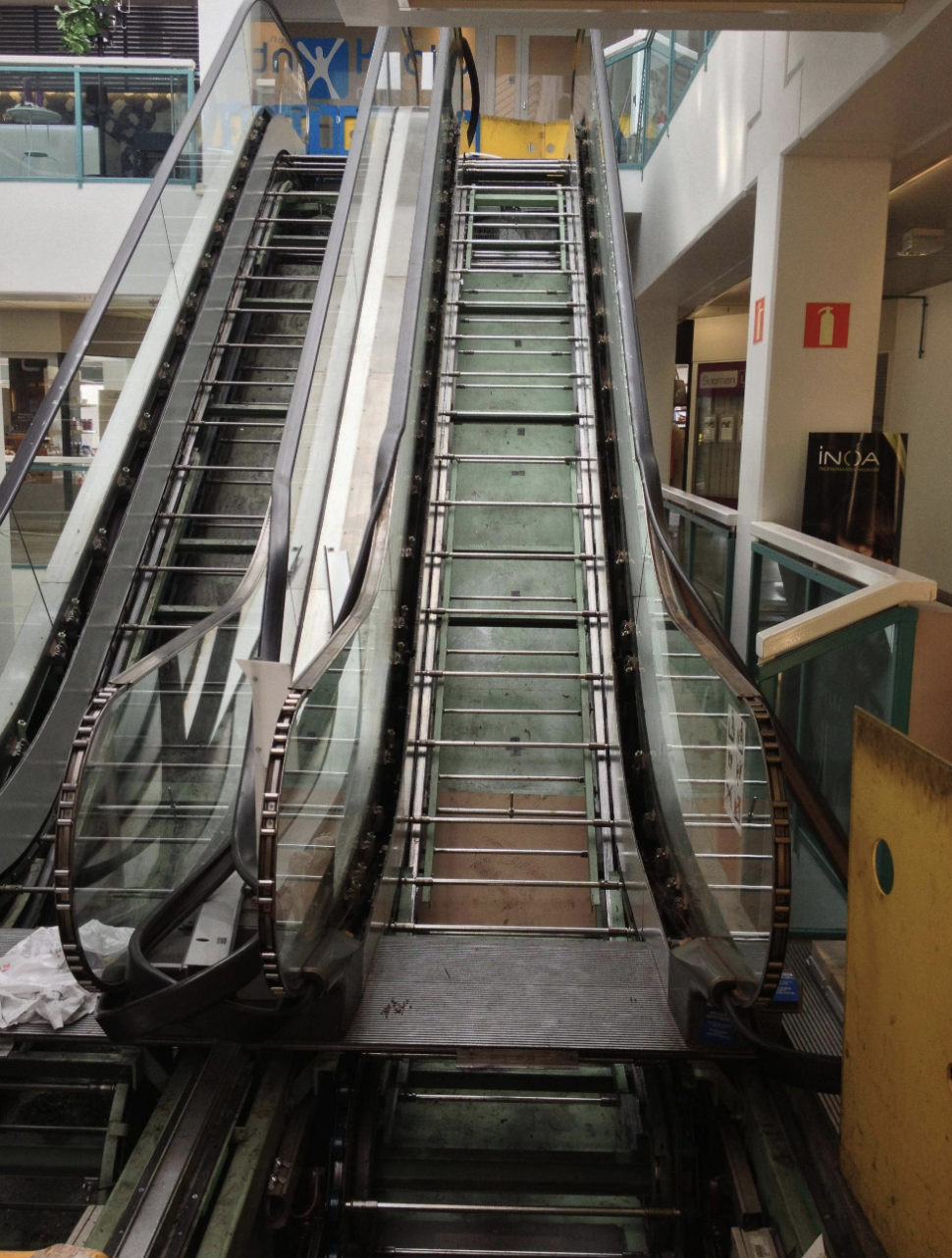 metal rods going across the escalator