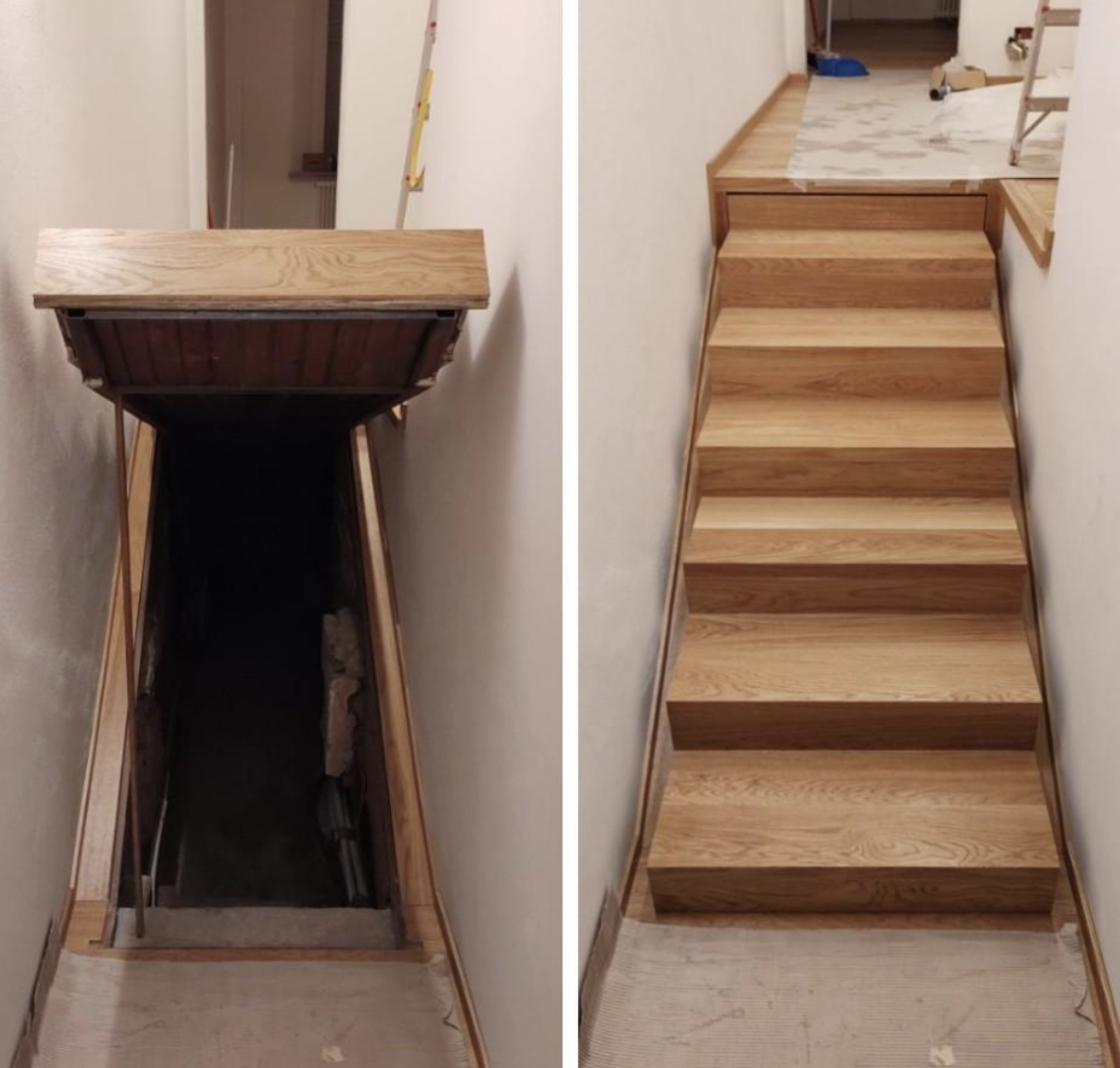 a trap door beneath the stairs leading to a basement