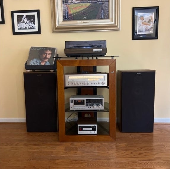 A wooden entertainment system in a livingroom