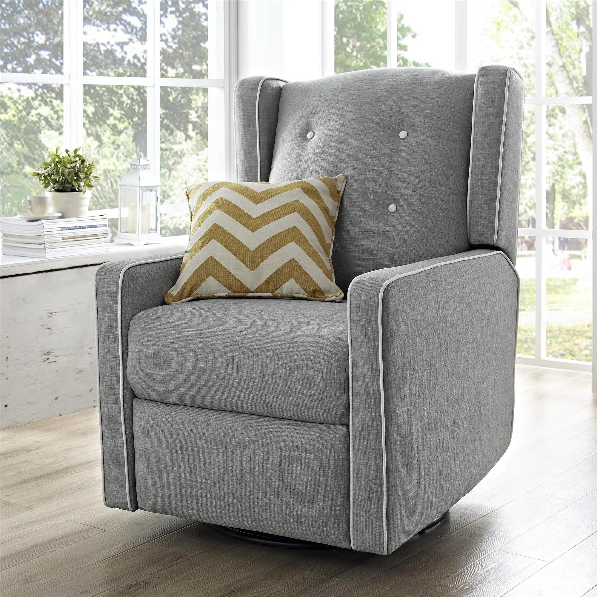 The recliner chair in a wingback design in grey