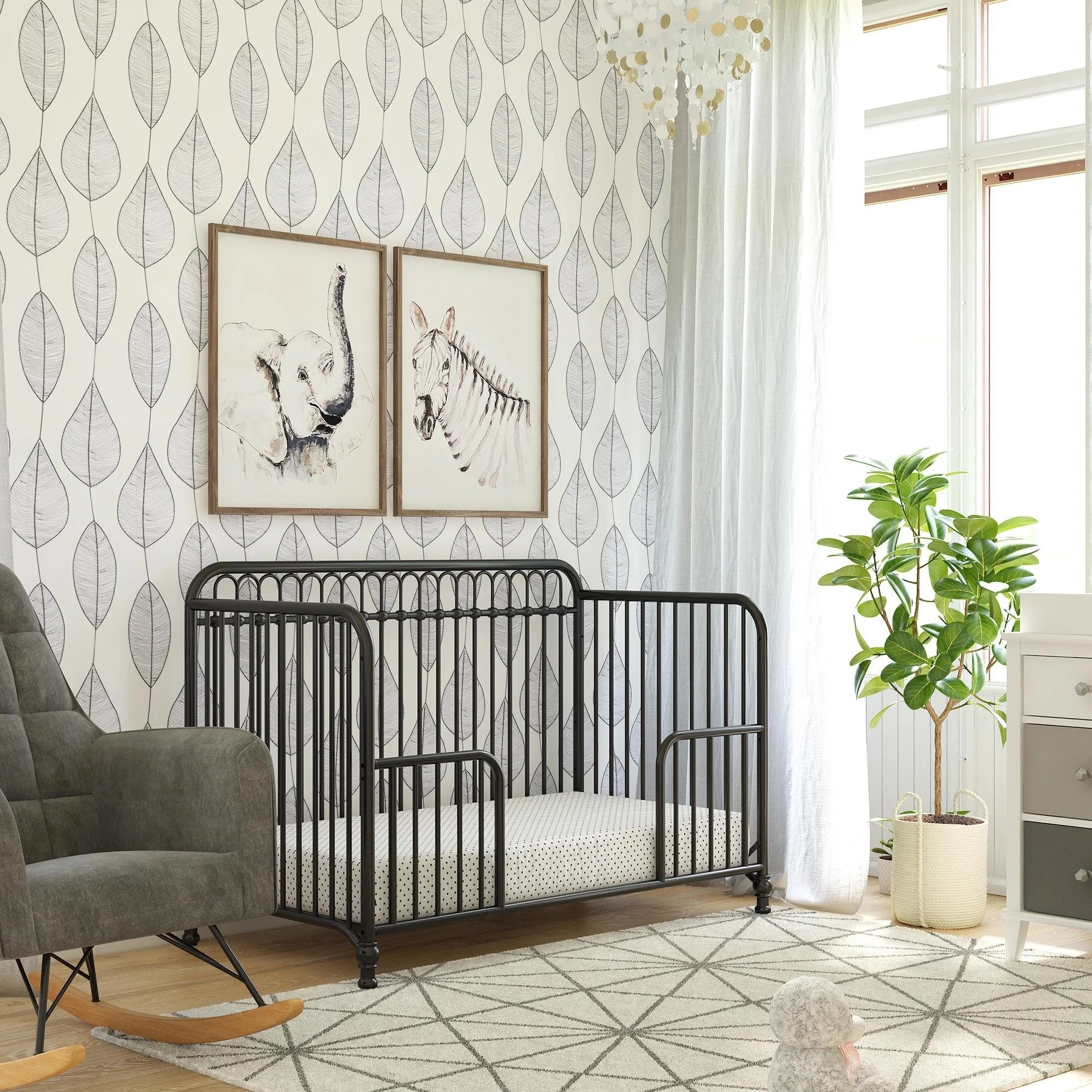 The crib converted into a toddler bed, in black