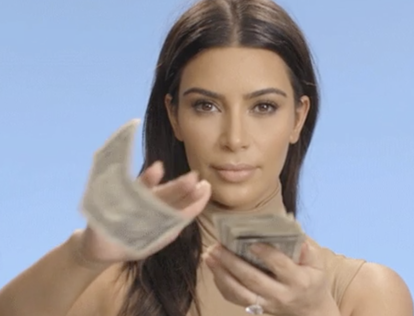 woman throwing money at the camera