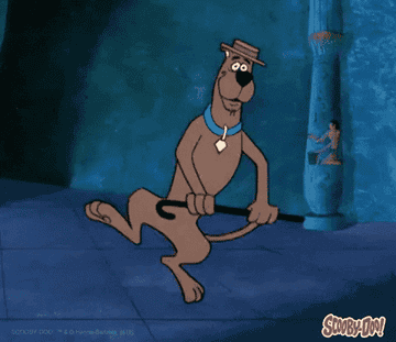 Gif of Scooby Doo tap dancing happily