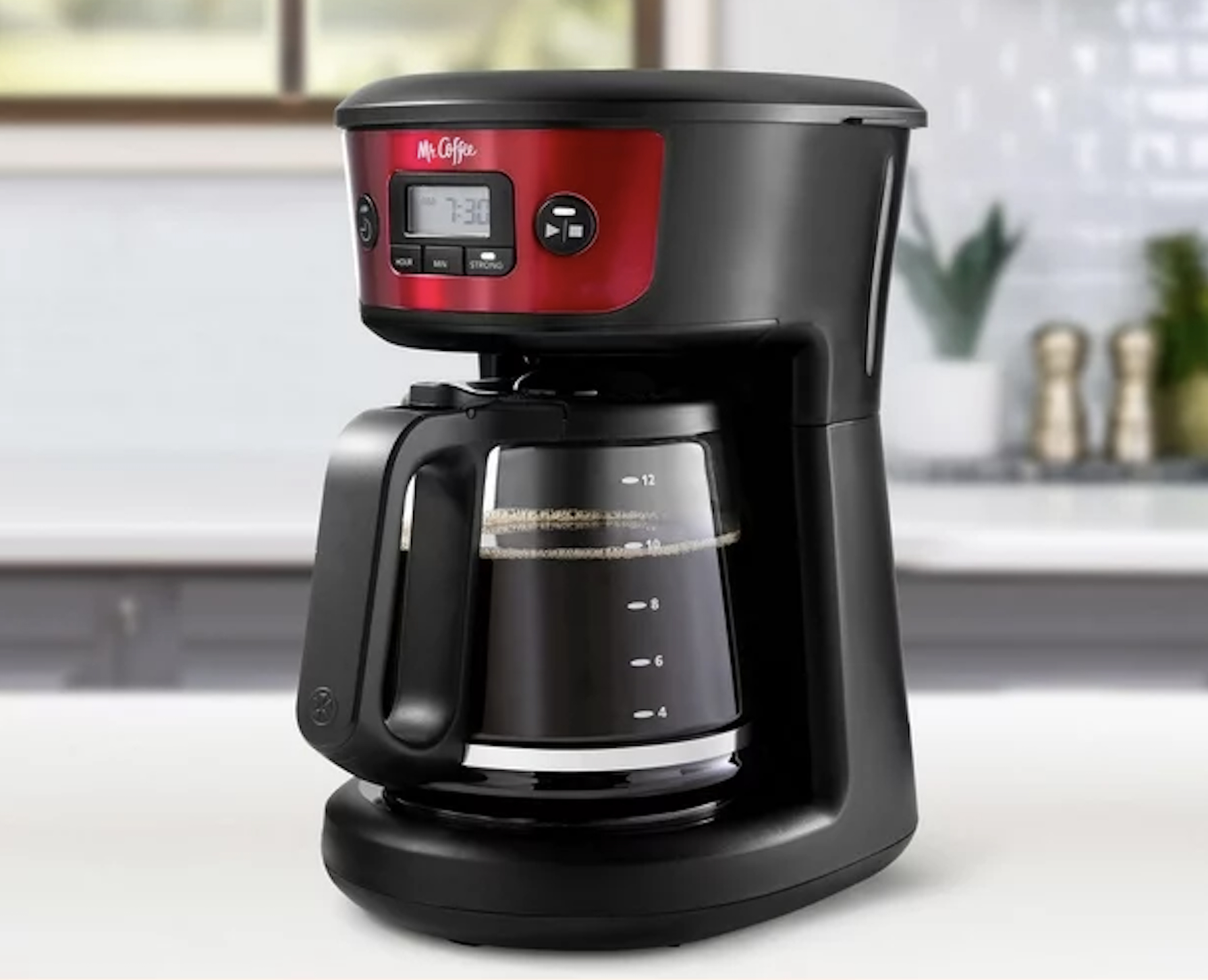 the coffee maker full of coffee on a table