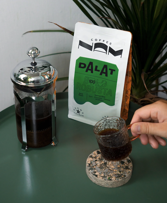 nam coffee beans bag with french press and mug of coffee