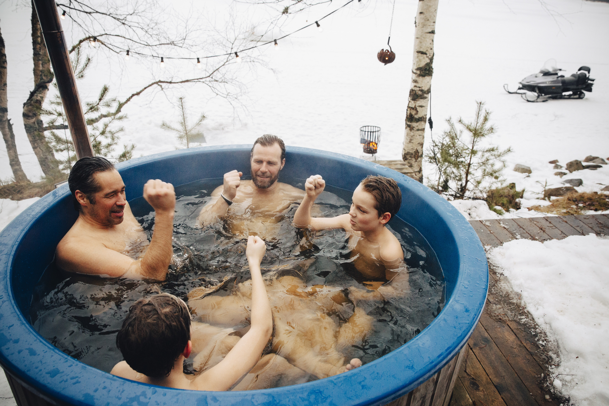 A group of men are in the hot tub