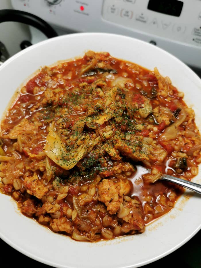 A cabbage stew topped with herbs