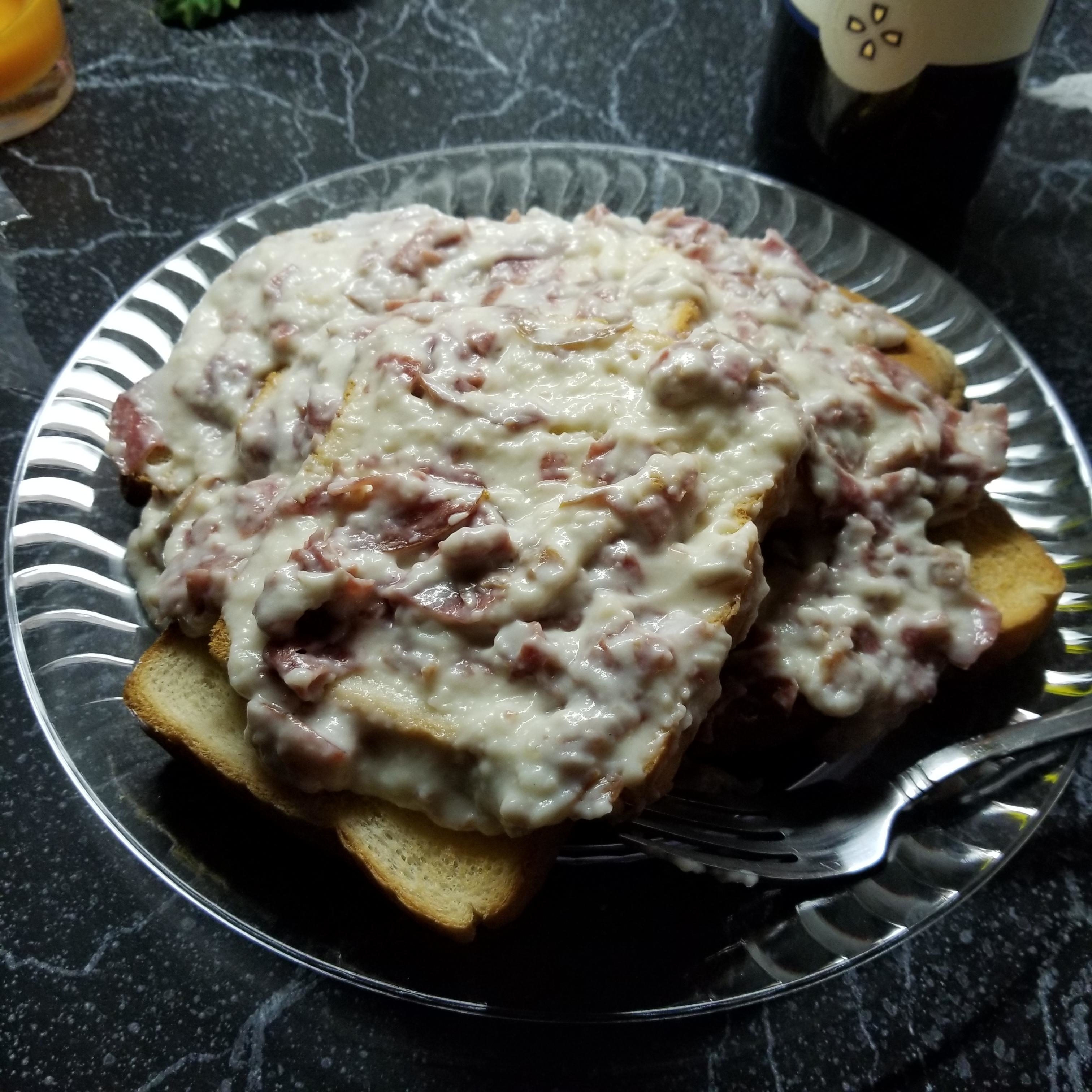 Cream chopped beef over two slices of white toast