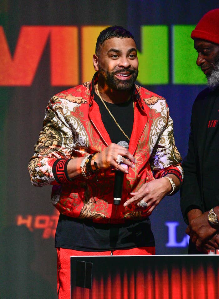 Ginuwine onstage at a podium