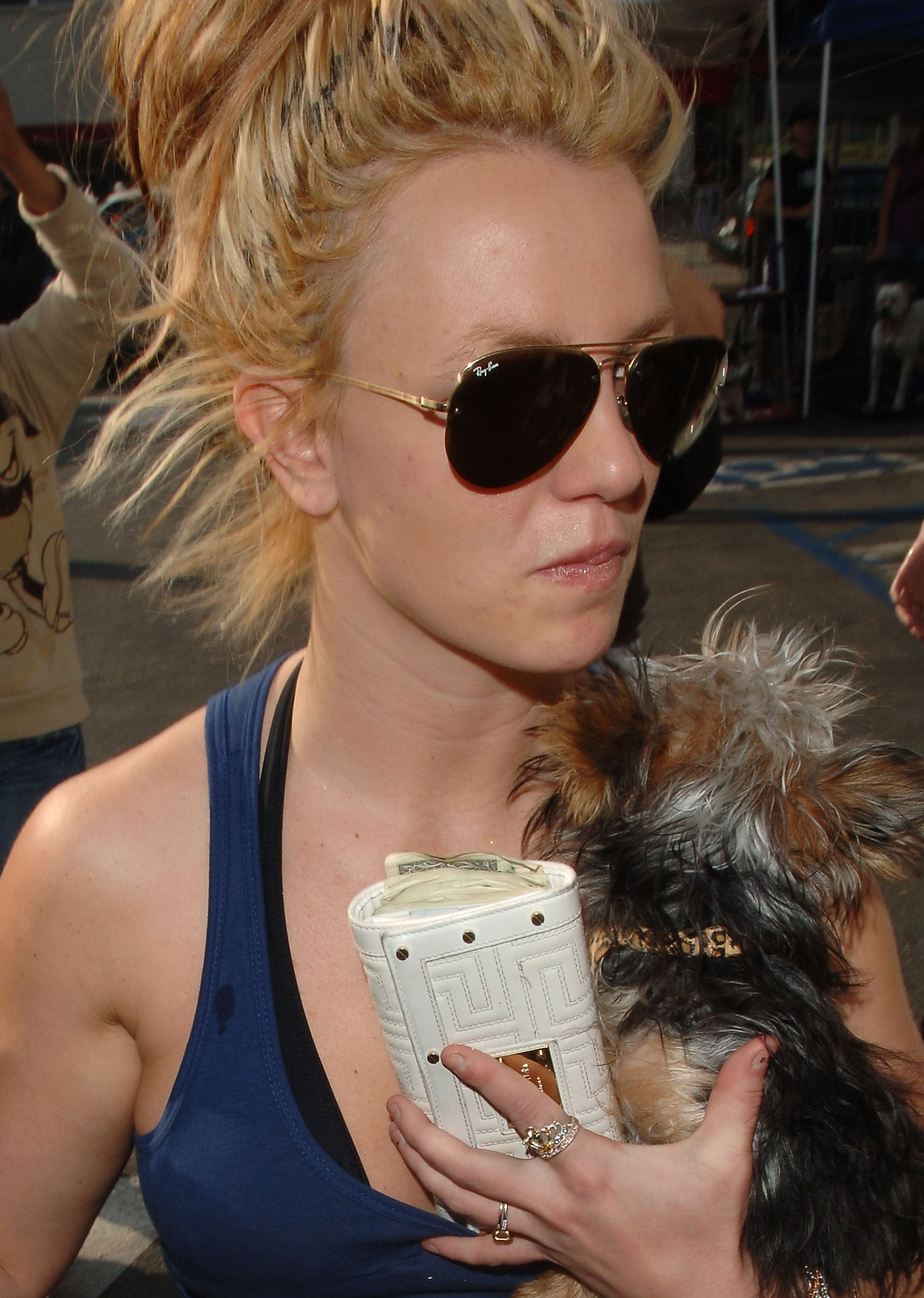 Close-up of Britney wearing sunglasses, a halter top, and her hair up