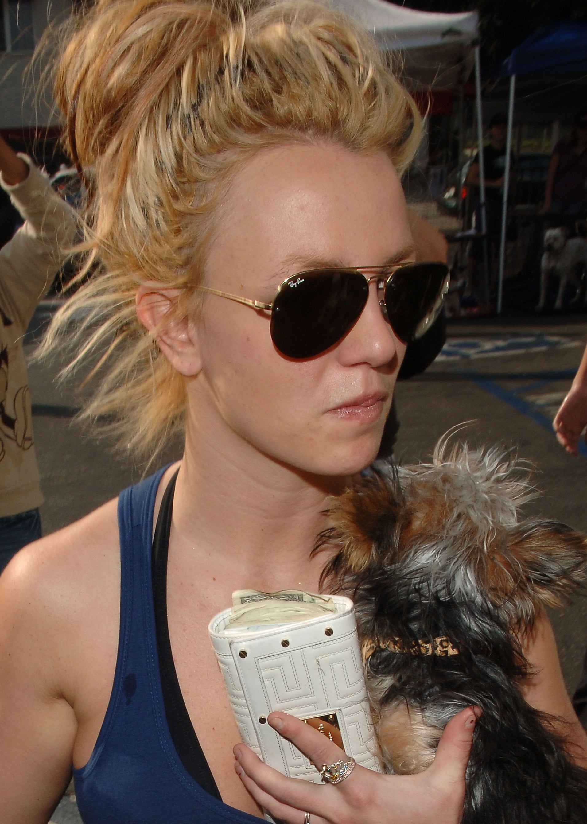 Close-up of Britney wearing sunglasses, a halter top, and her hair up