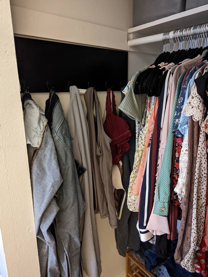 Two sections for clothes in a closet: one for clean clothes and one for worn clothes that are still clean