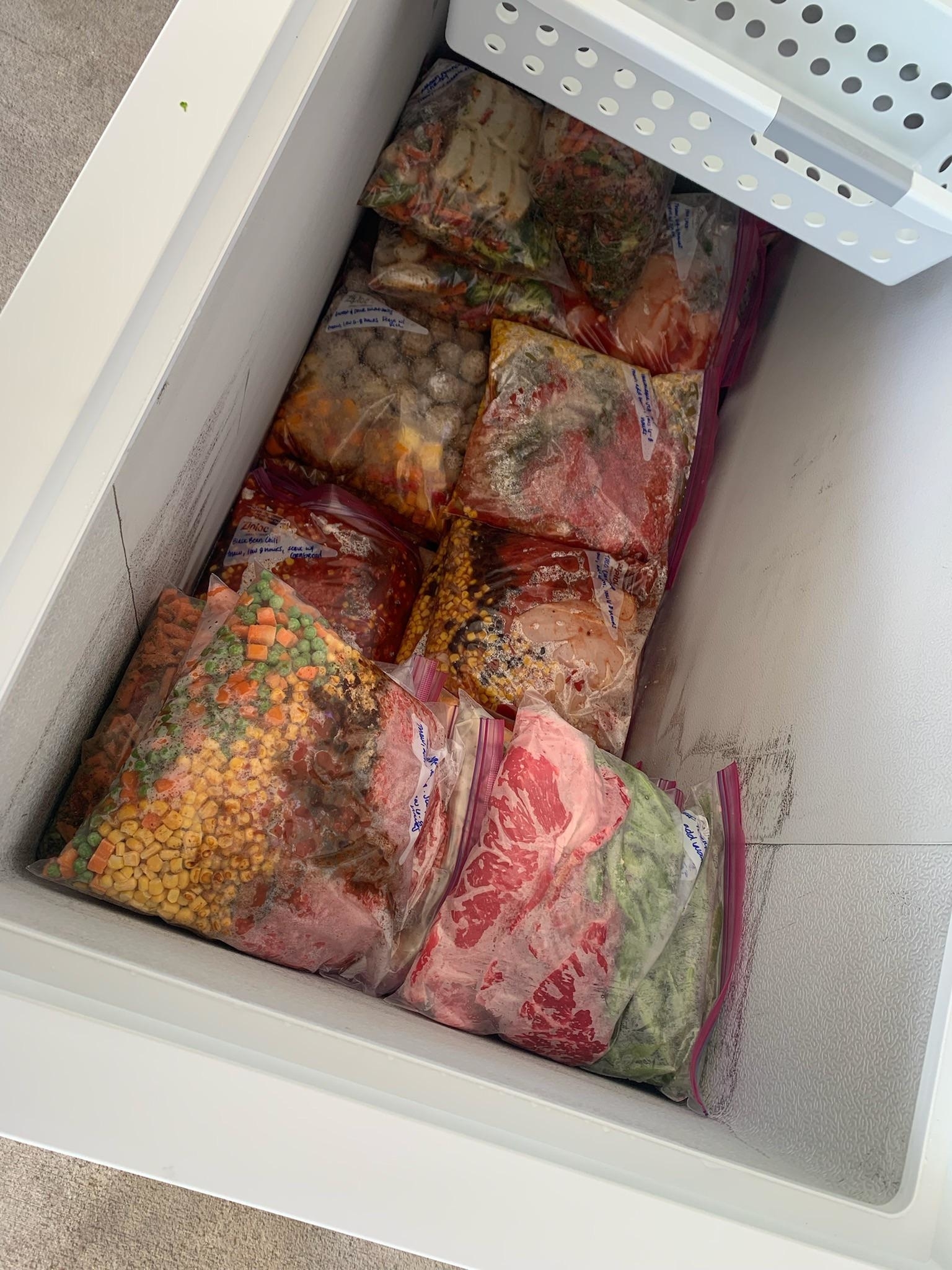 Chest freezer full of frozen meals for the slow cooker