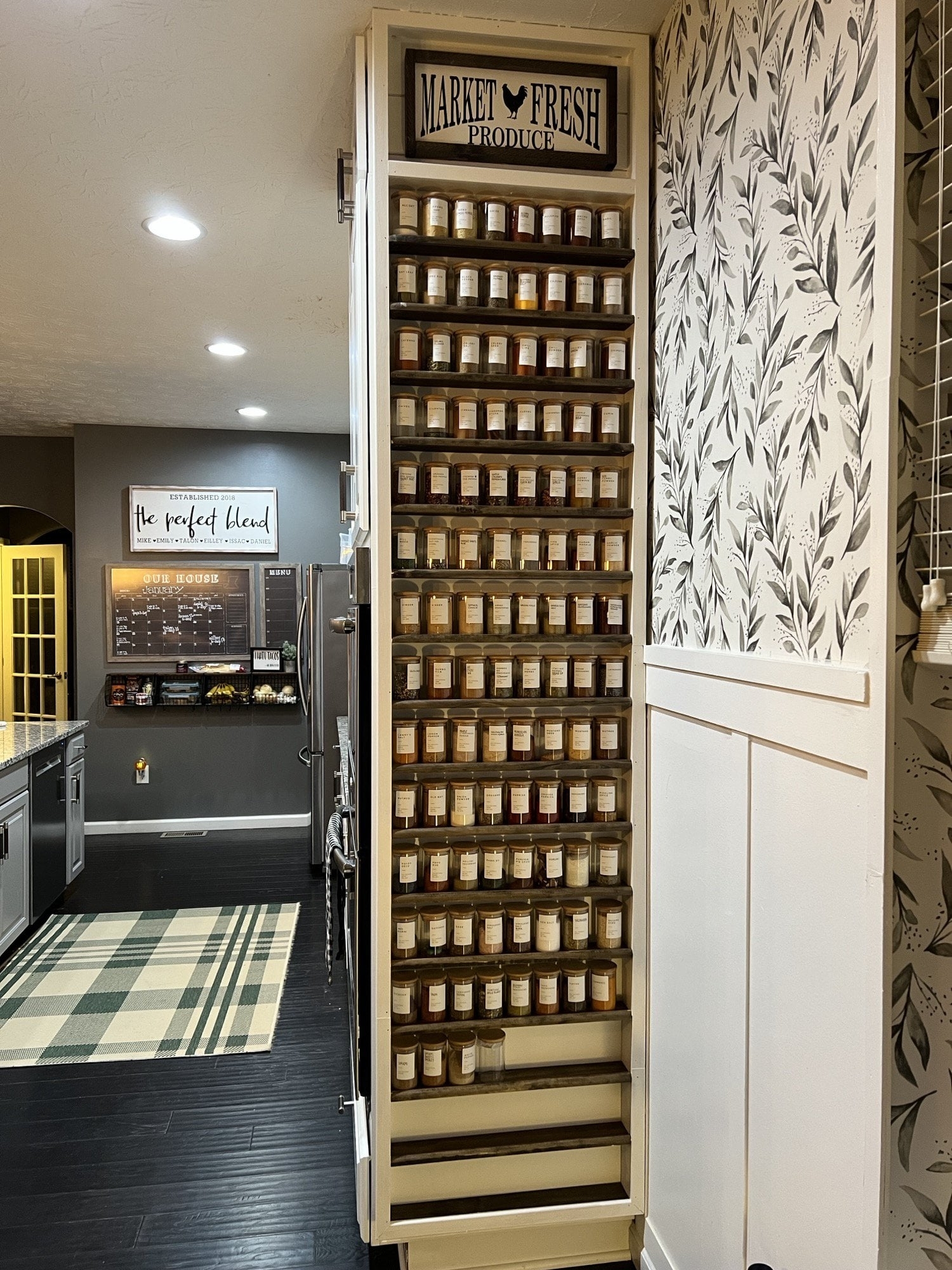 A tall vertical organizer with shelves for all dried spices and herbs