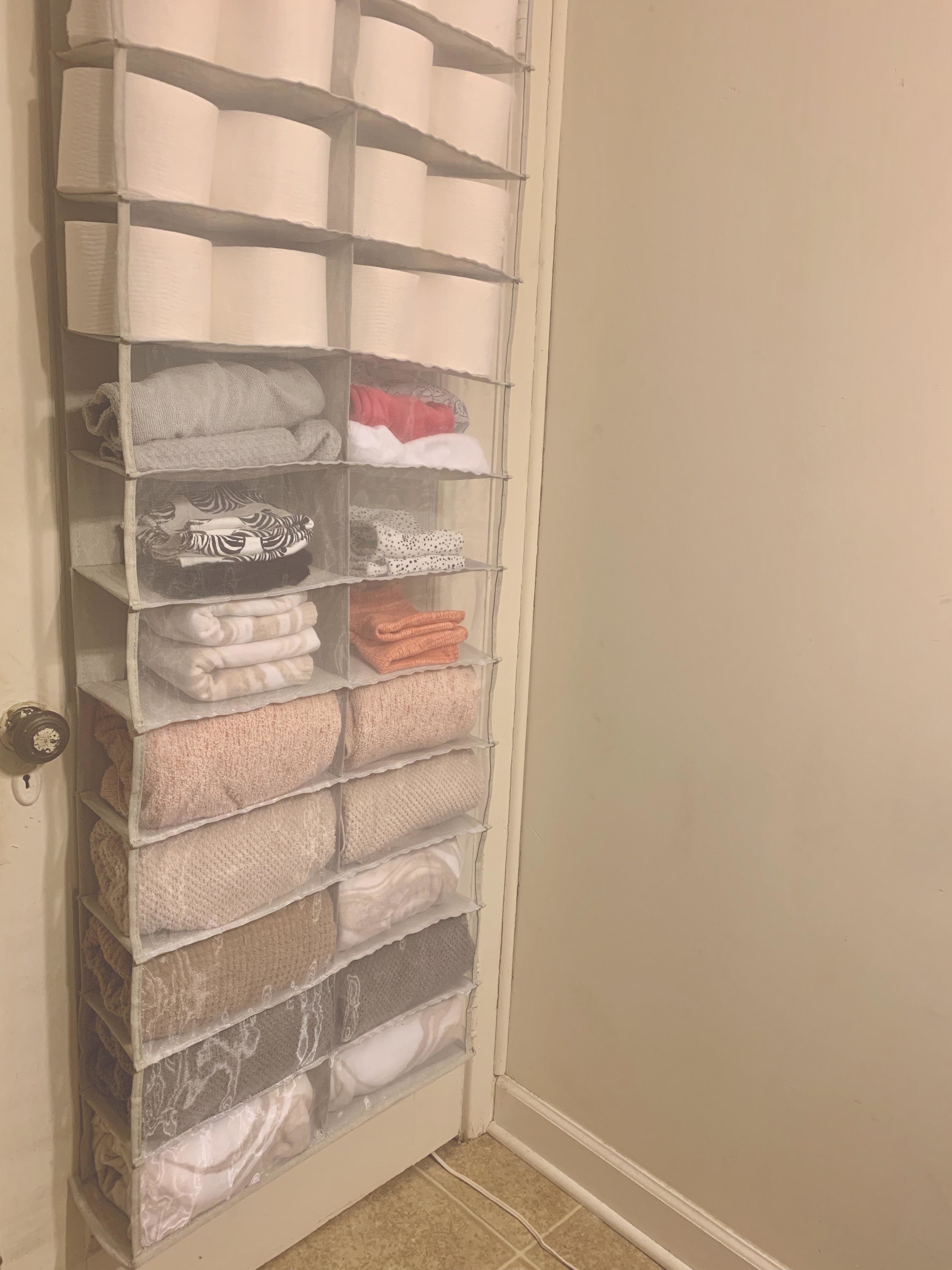 shoe organizer turned into a linen organizer with sheets, towels, and more