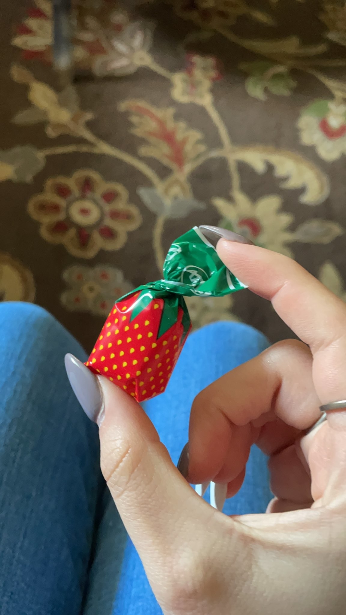 A candy with a strawberry-colored wrapper