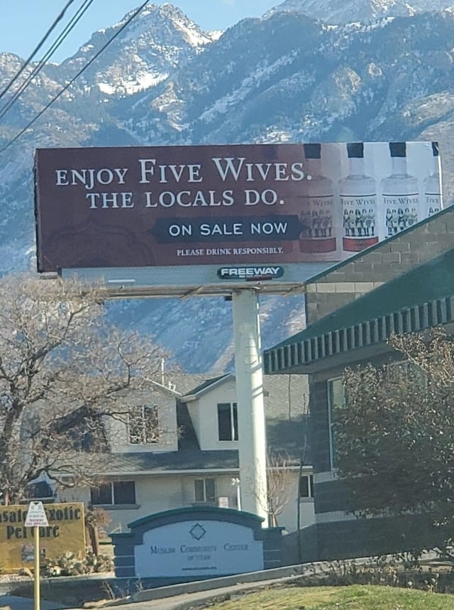 alcohol ad reads, enjoy five wives, the locals do