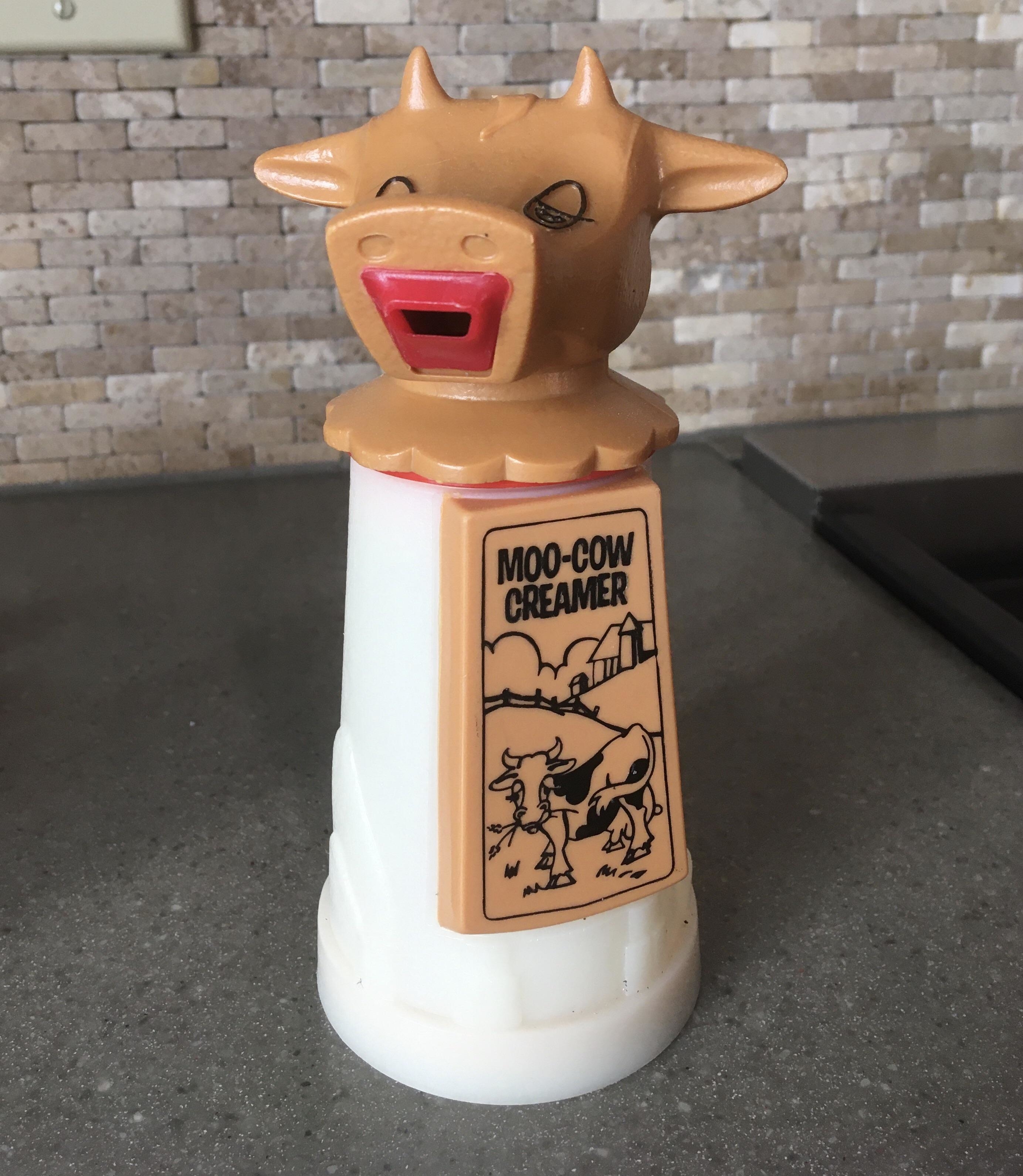 moo cow creamer bottle with the head of a cow as the pouring spout