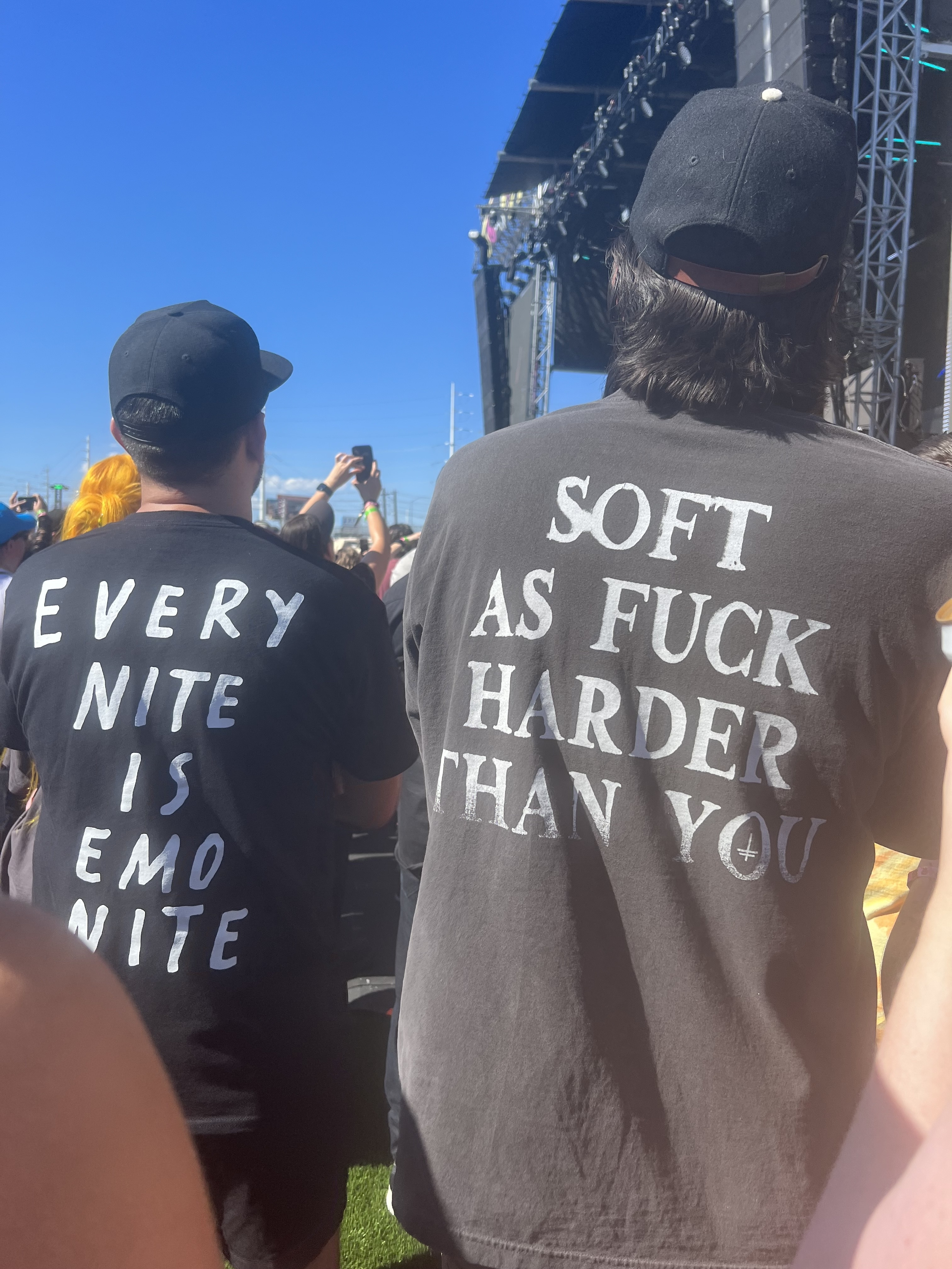 guys wearing shirts reading, every nite is emo nite and soft as fuck harder than you