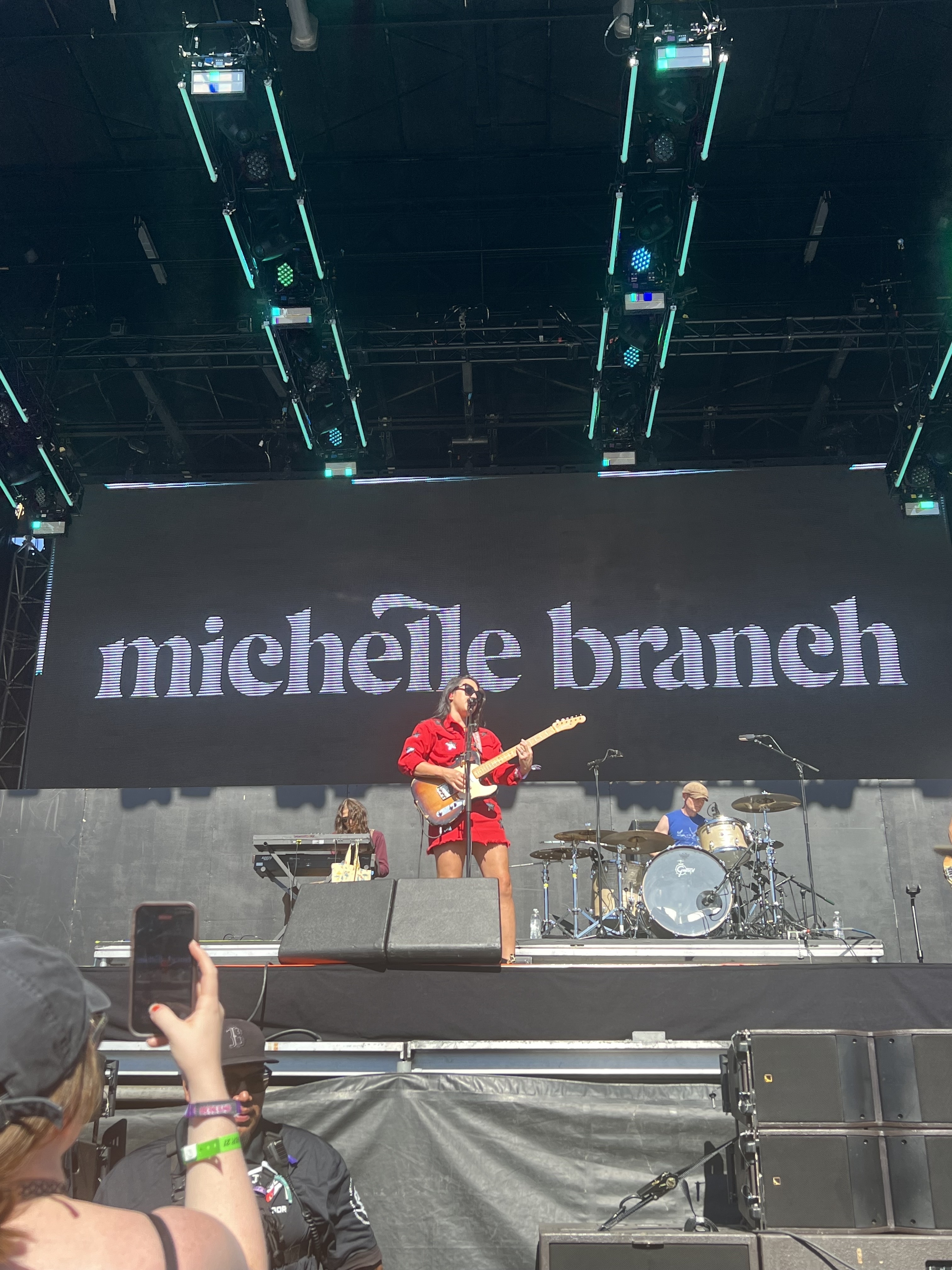michelle playing her guitar on stage