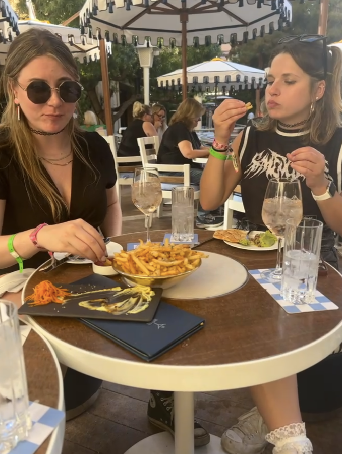 two of the women sitting to eat