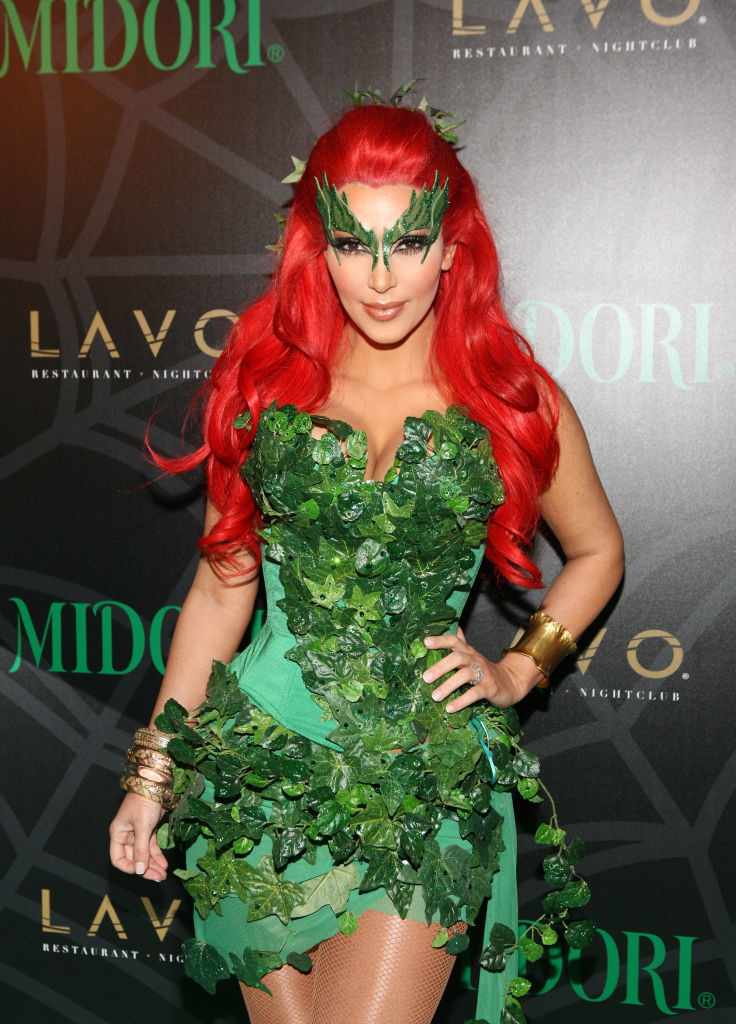 she&#x27;s wearing the red wig and poison ivy leaves as a dress