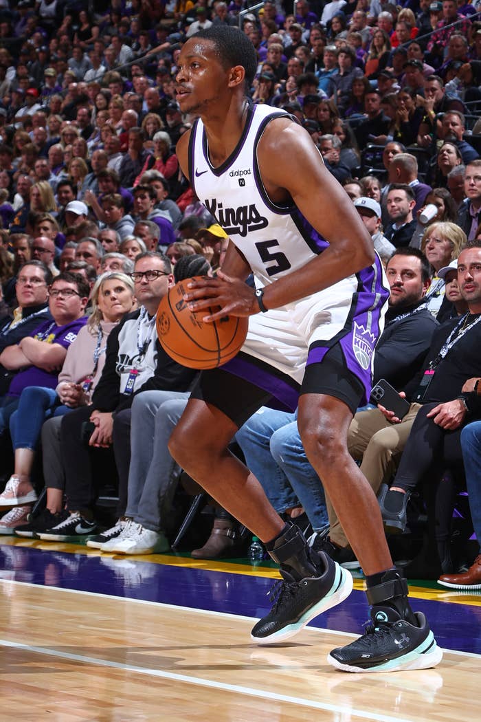 De&#x27;Aaron Fox #5 of the Sacramento Kings looks to shoot the ball during the game against the Utah Jazz on October 25, 2023 at Delta Center in Salt Lake City, Utah.