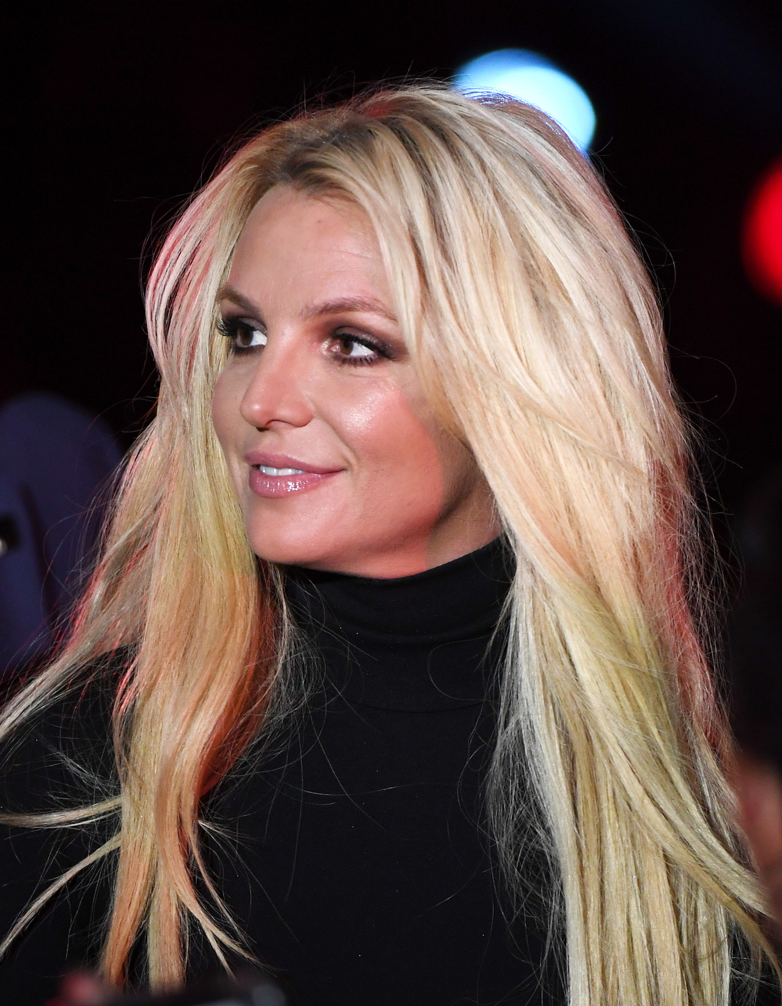 Close-up of Britney wearing a turtleneck