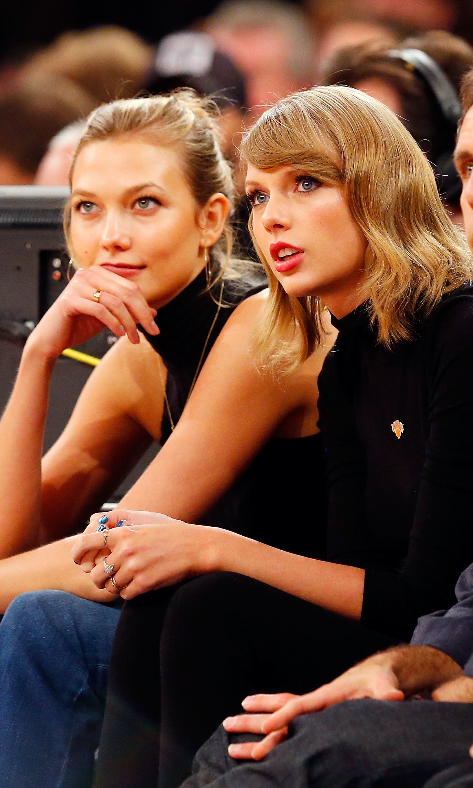 Close-up of Taylor and Karlie sitting together