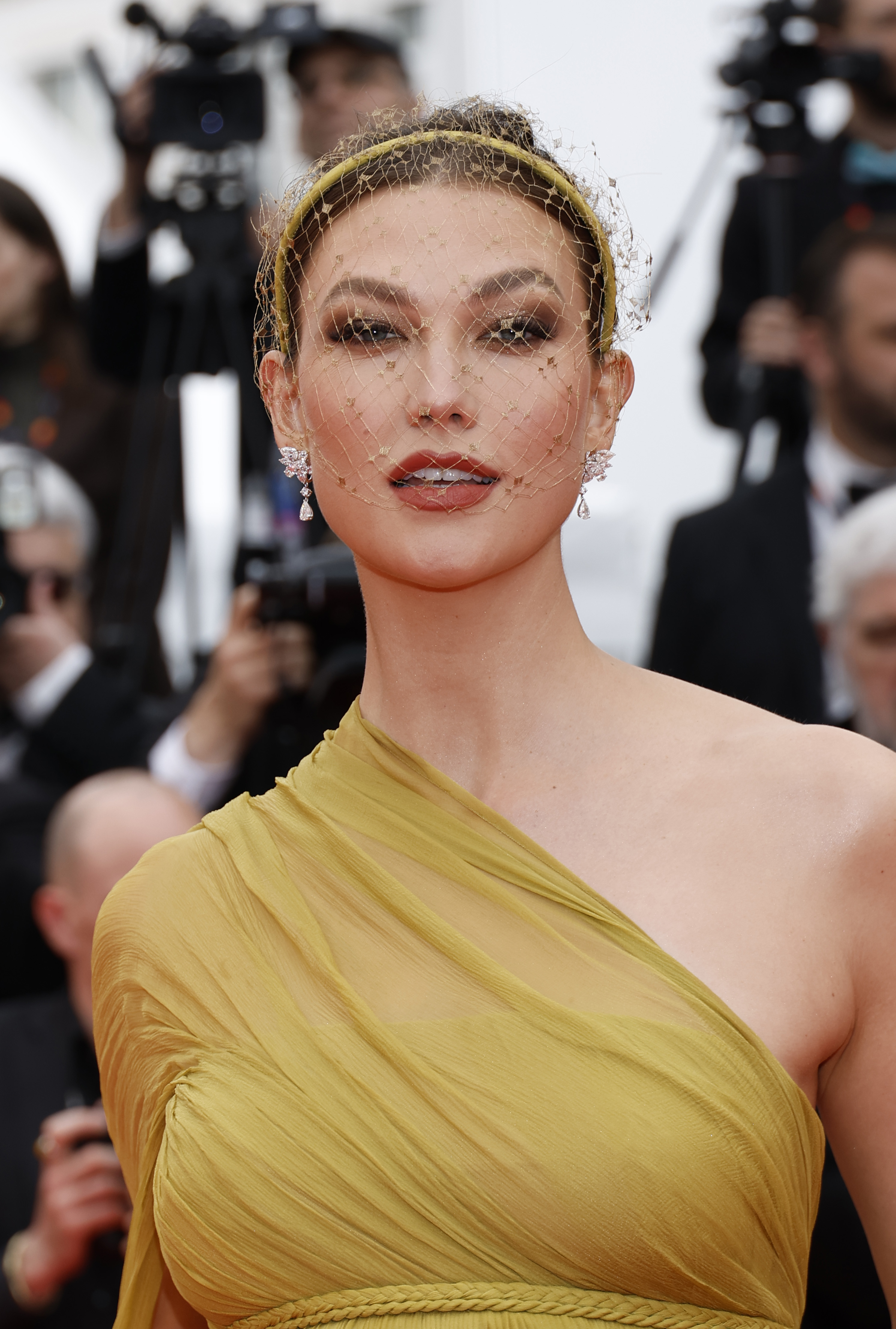 Close-up of Karlie at a media event