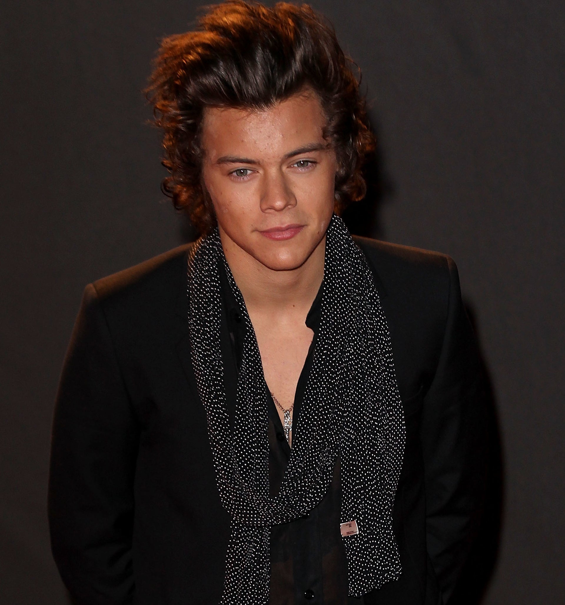 Close-up of Harry wearing a jacket and loose scarf