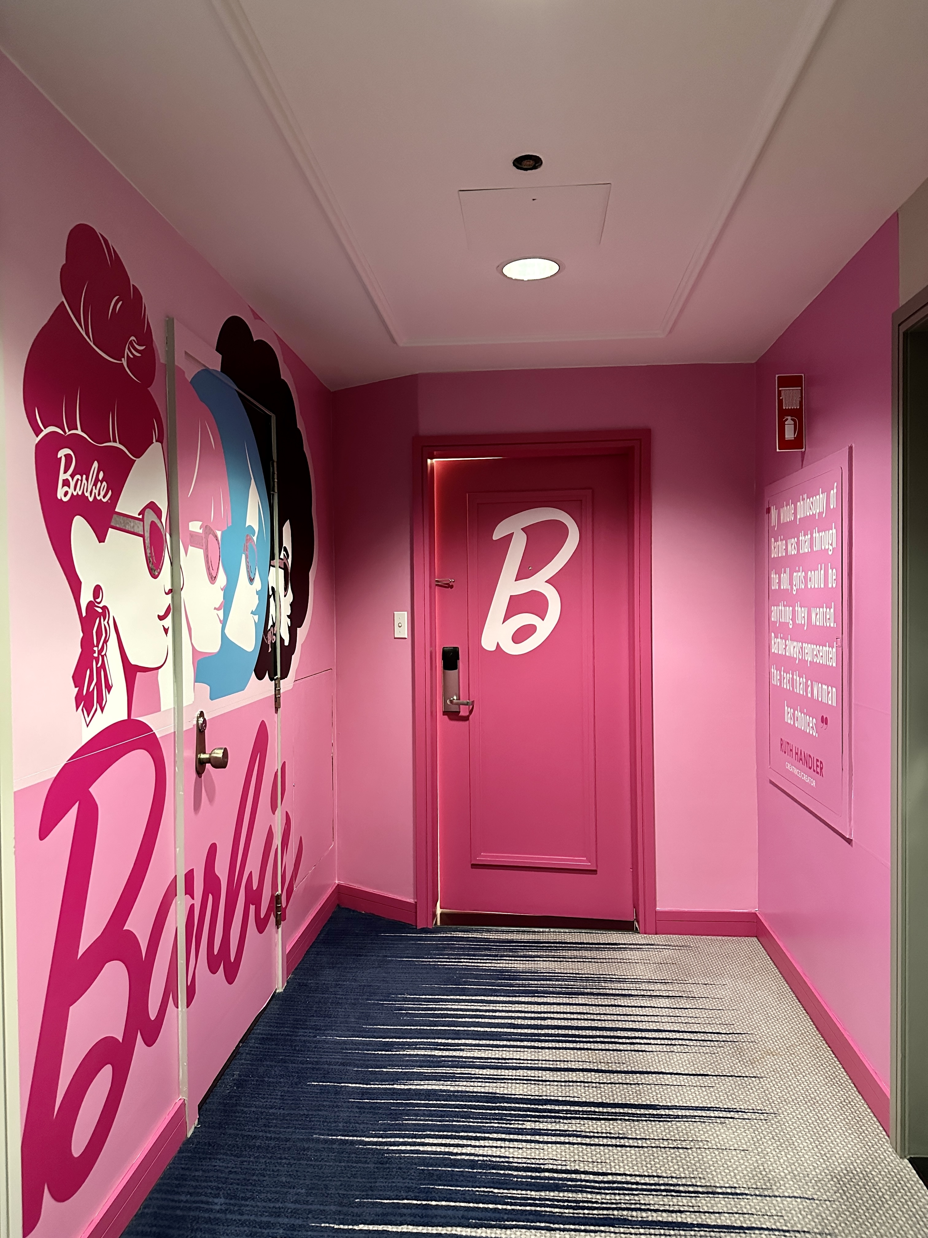 A pink door and pink walls greets you as you enter the Barbie suite.